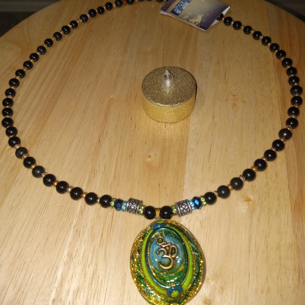 OM emblem necklace